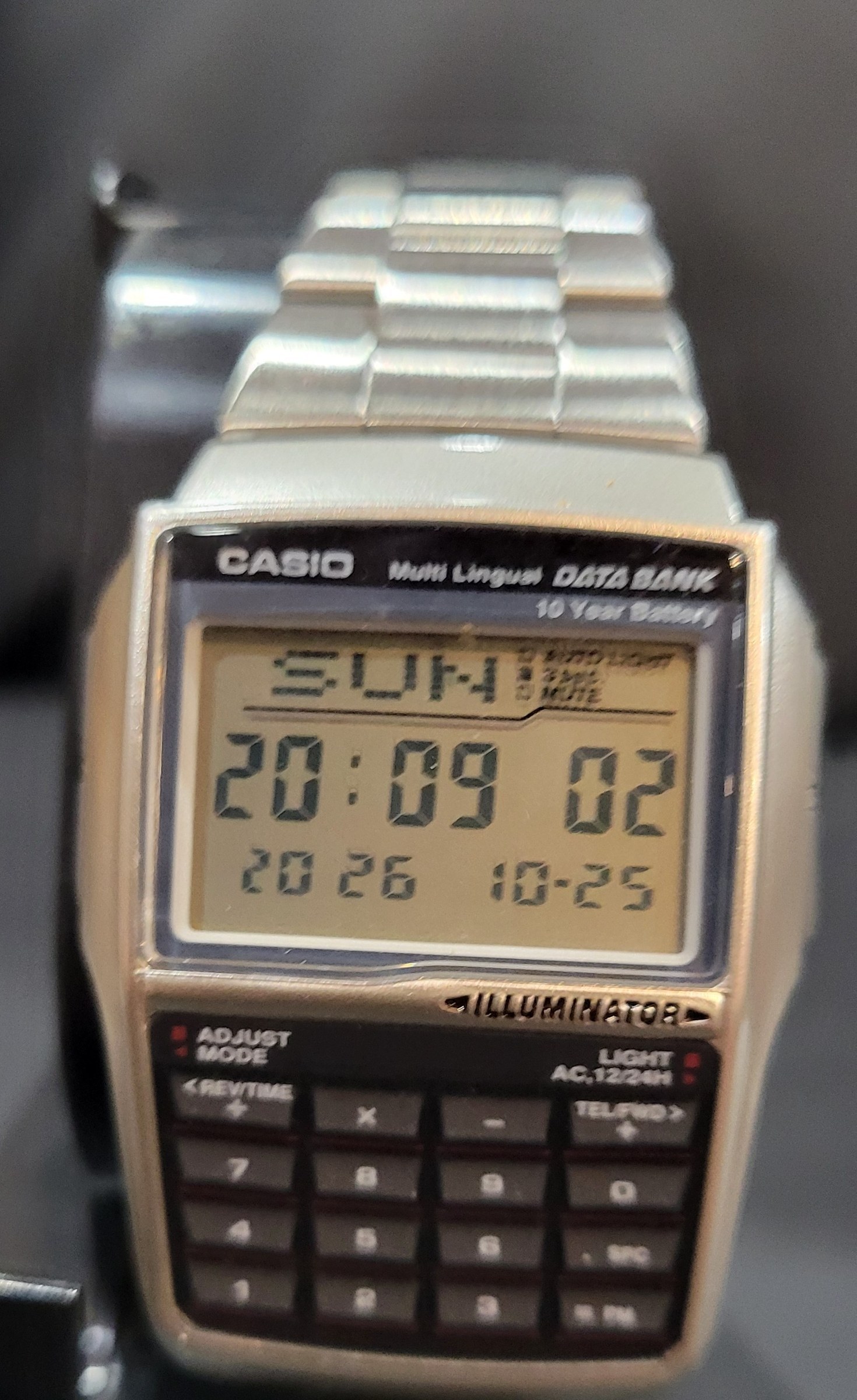 Figure 3 — My DBC-32 again, a few seconds later. The keypad below the display carries the digits, the four arithmetic operators, .SPC and =PM.