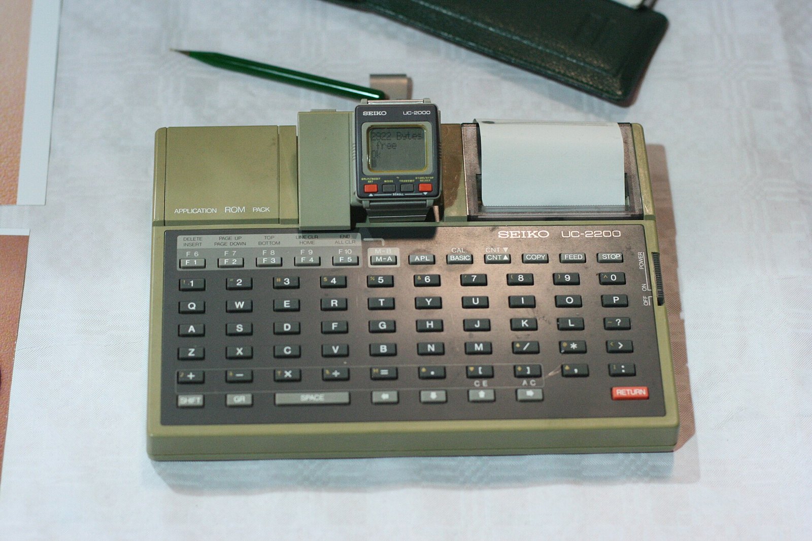 Figure 11 — A Seiko computer watch of the mid-1980s docked on its keyboard and printer: by then the watch was becoming a terminal as well as a calculator.