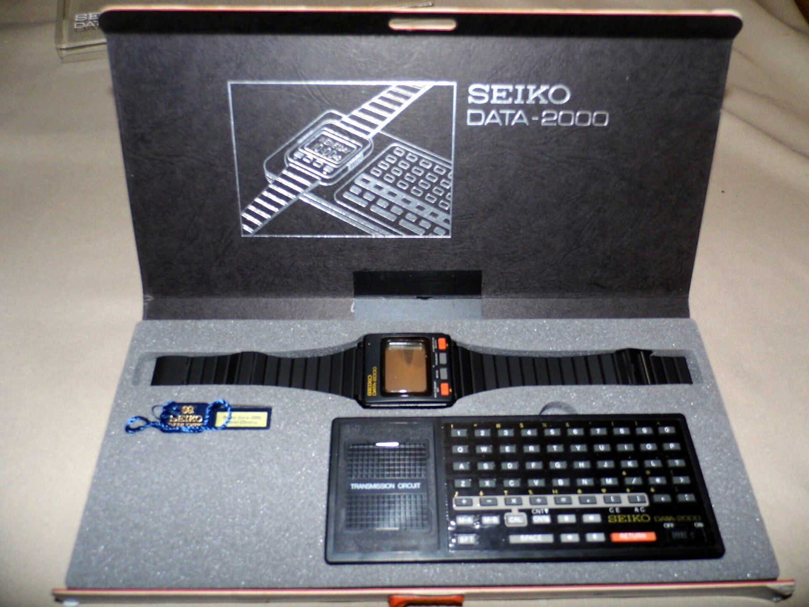 Figure 10 — The Seiko Data 2000 of 1983 in its box, with the pocket keyboard that loaded notes into the watch.