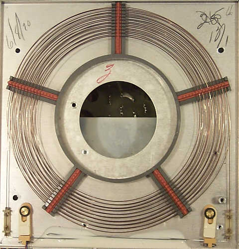 Figure 12 — Inside a later Friden delay line: the coiled wire on its pads. The 116x machines used about 40 feet of beryllium-copper wire with a 4 ms delay and a single tape per transducer.