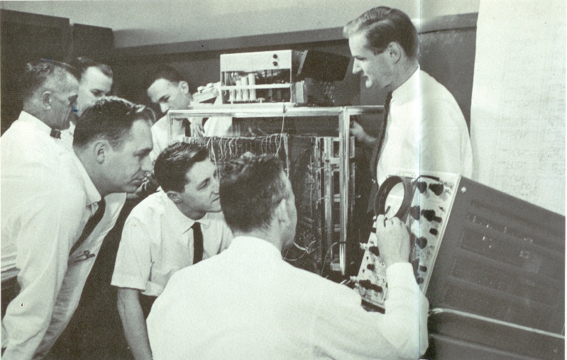 Figure 5 — Friden engineers with the EDTC-3 delay-line prototype in June 1962.
