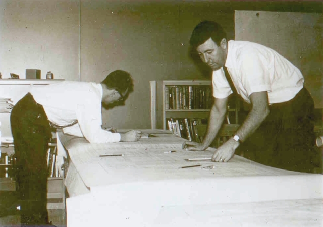 Figure 5 — Larry Kramer and Dick Ahrens of Friden with the EC-130's master schematic.