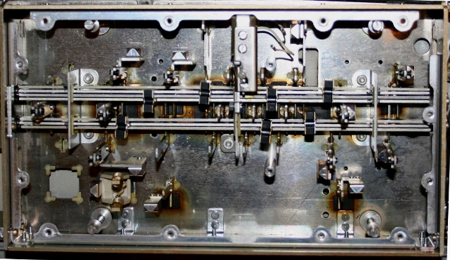 Figure 3 — The mechanism under the EC-132's keys: the code bars of the mechanical encoder and the reed switches they operate.