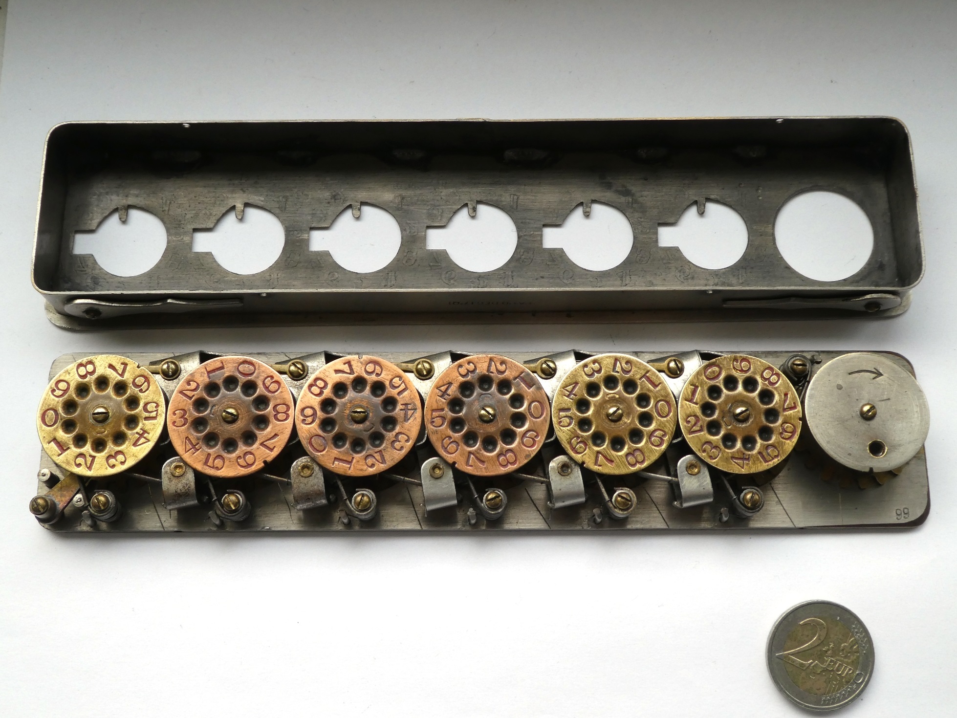 Figure 9 — The Calcumeter with its cover removed: the row of stylus wheels, and between them the latches that push the carry from one wheel to the next.