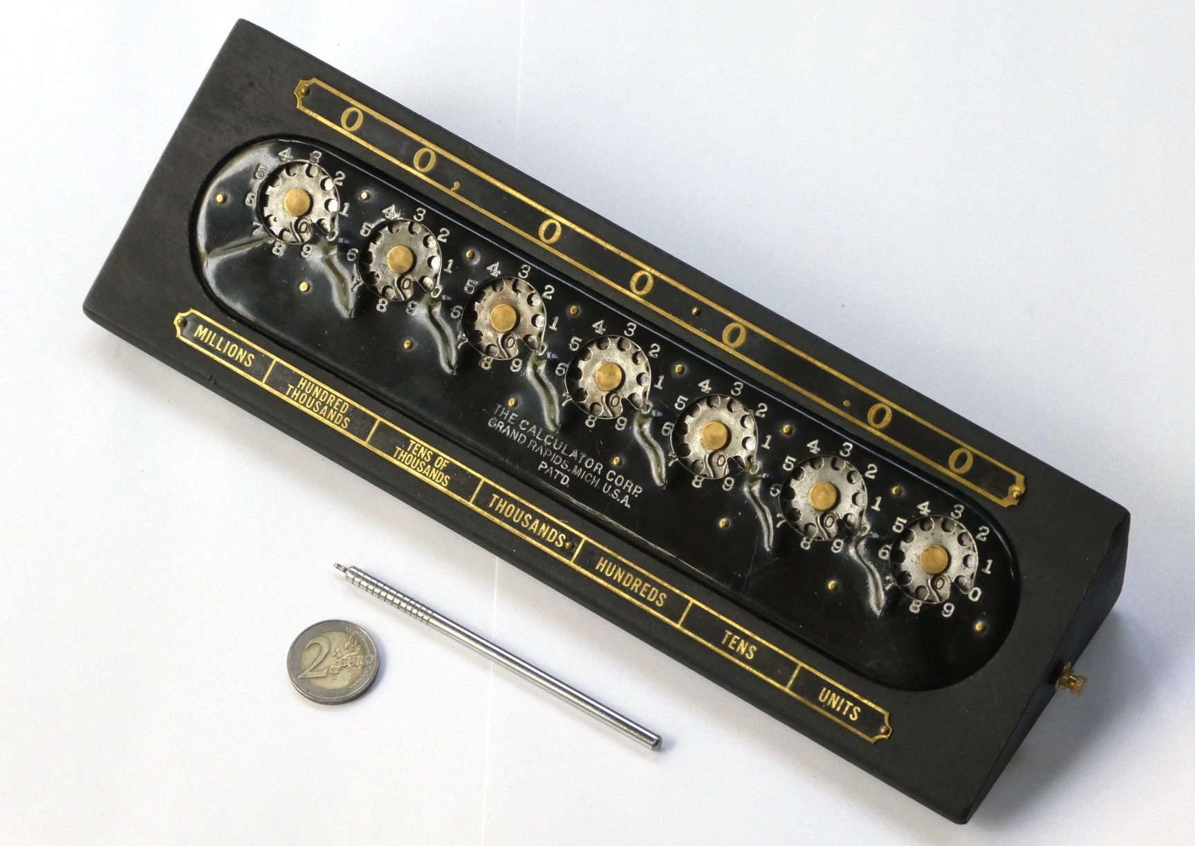 Figure 14 — The Calculator, Grand Rapids, Michigan, c. 1915–21: Bonham's design in black enamel on its wooden wedge stand, with its steel stylus. The result is read in the dials themselves, not in separate win…