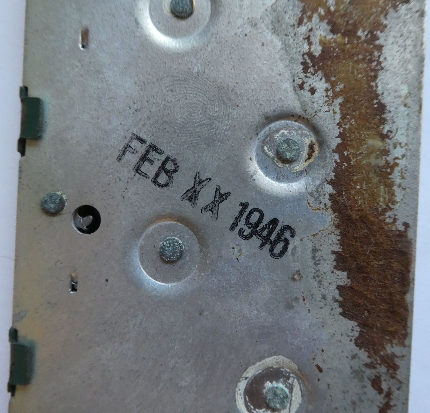 Figure 4 — The factory date stamp on the back plate of the same machine: FEB 1946.