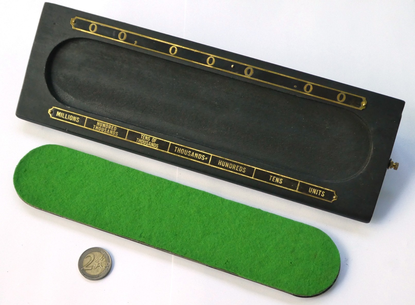 Figure 3 — The Calculator of Grand Rapids lifted from its wooden stand, showing the green felt on its back. The Grand Rapids machines are riveted shut.