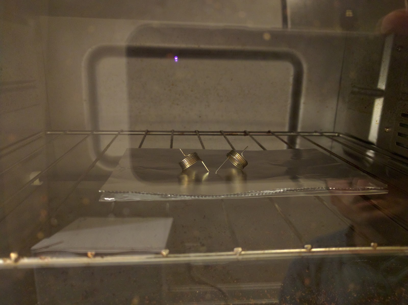 Figure 6 — Wound springs being tempered in a toaster oven at 450–500 °F.