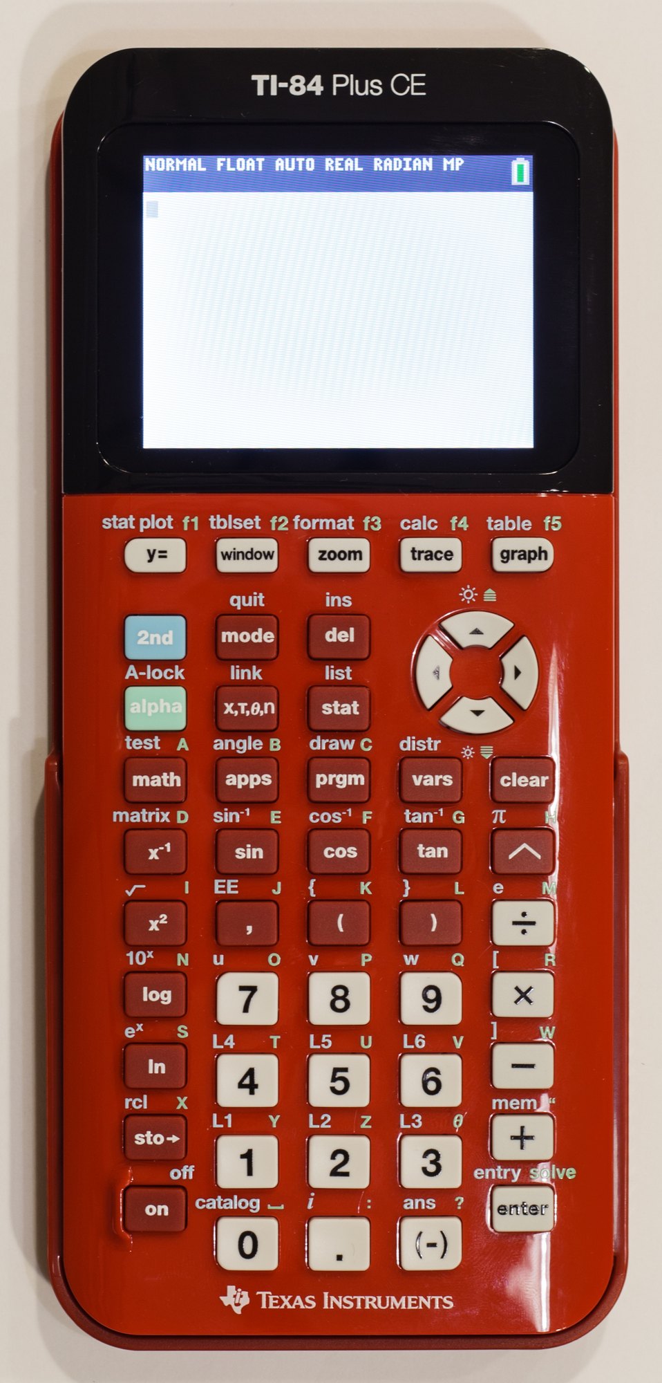 Figure 2 — An early TI-84 Plus CE in Radical Red, photographed in March 2015, with the home screen's blue status bar showing the mode settings and battery.