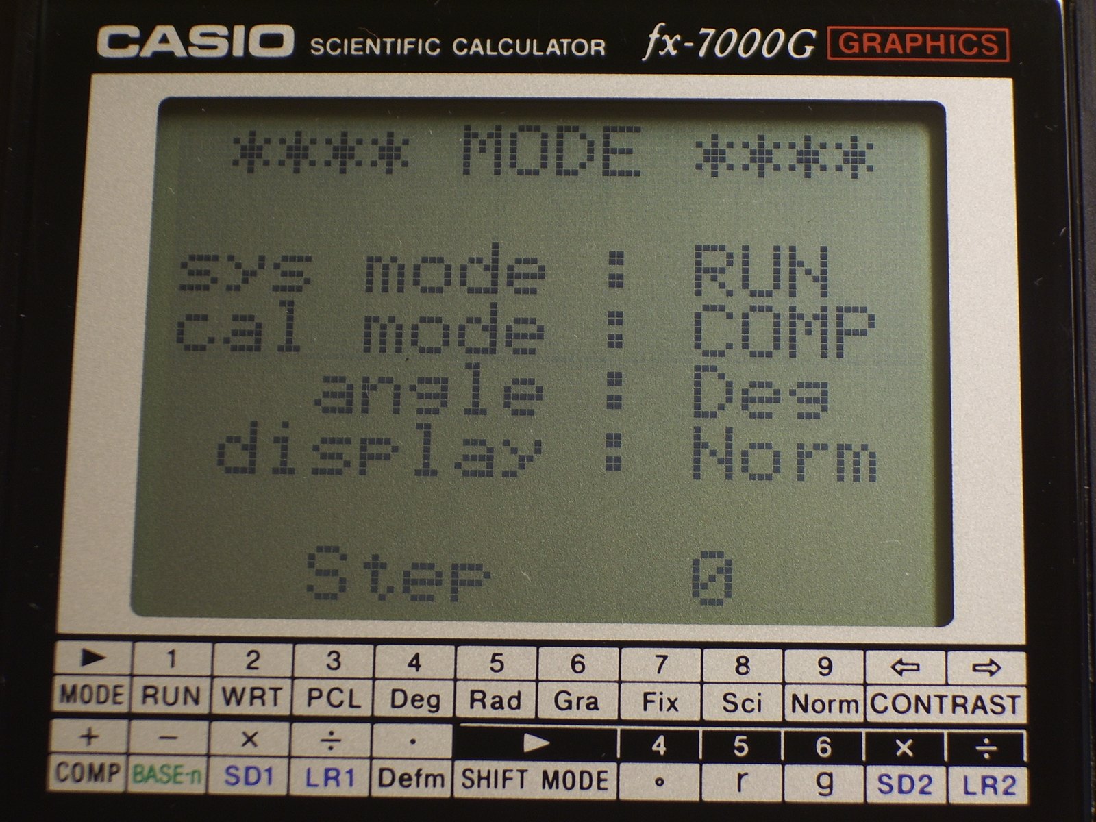 Figure 3 — The fx-7000G's mode screen on power-up: RUN or program mode, COMP calculation, degrees, normal display, and step 0 of the program memory.