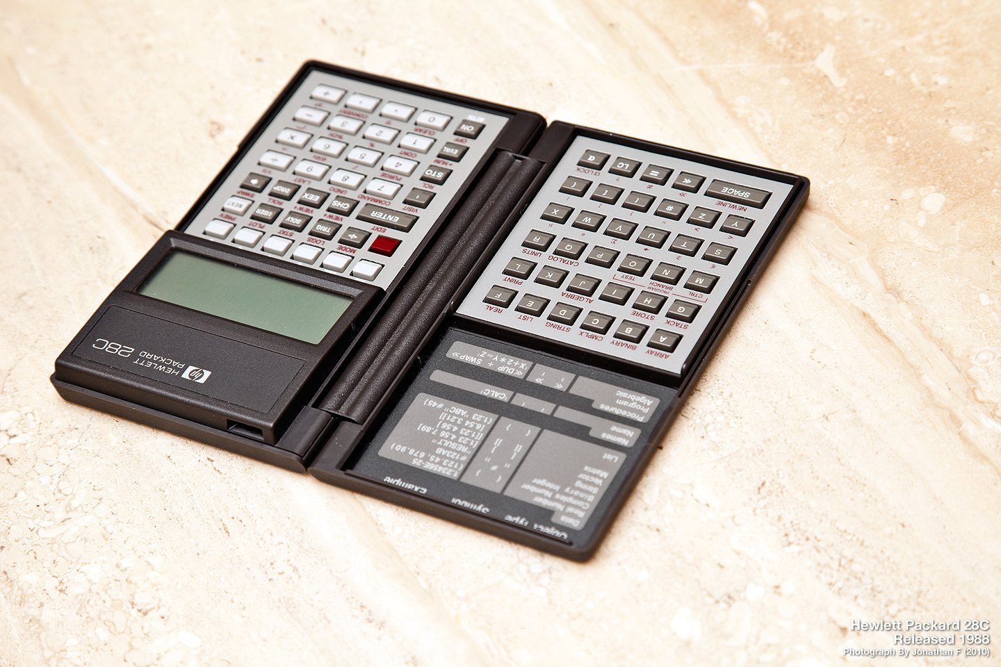 Figure 6 — The HP-28C of 1987, open: alphabetic keys on the left half, the calculator on the right, the four-line screen across the top.