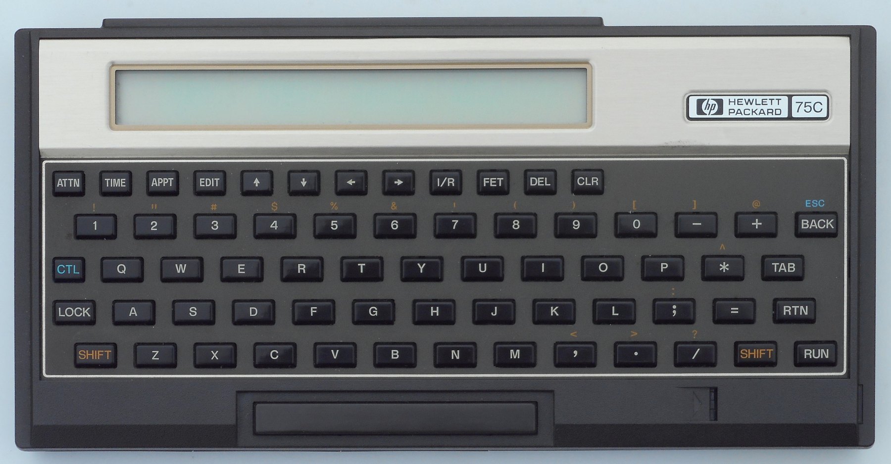 Figure 16 — The HP-75C of 1982, Hewlett-Packard's first portable computer, at $995. The card reader runs along the front edge below the keyboard.