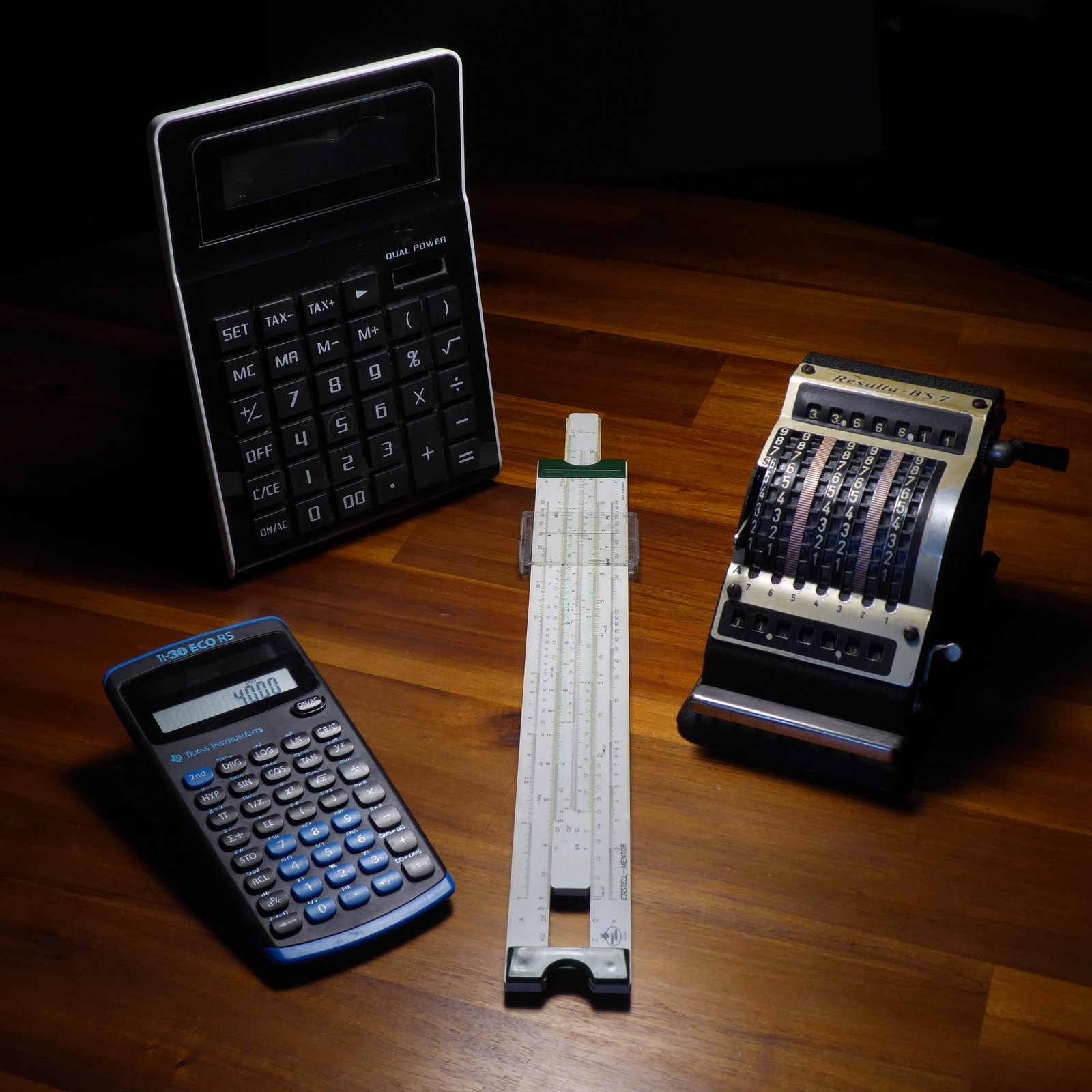 Figure 11 — Three ways to calculate: a Faber-Castell slide rule, a mechanical adding machine and a modern TI-30 ECO RS.