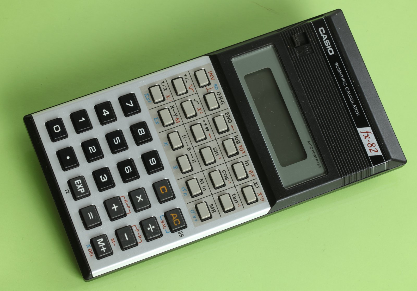 Figure 3 — The first Casio fx-82 of 1982, an LCD scientific in a hard wallet case.