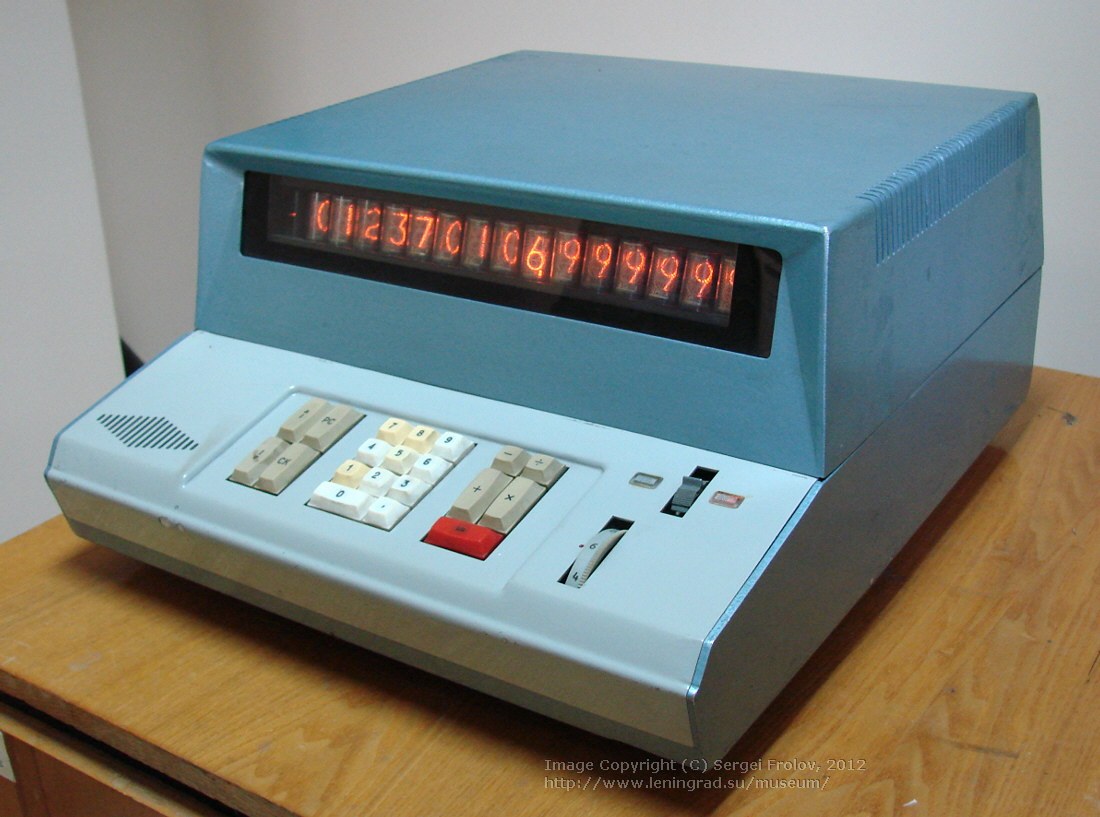Figure 9 — An Iskra 11M of 1972: sixteen IN-14 Nixie tubes and logic built from potted МИР-10 micro-modules, with no integrated circuits.