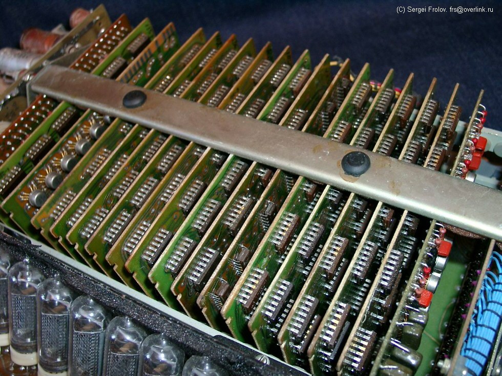 Figure 12 — The inside of an Iskra 123, the first Soviet programmable calculator: rows of logic boards behind the Nixie display.