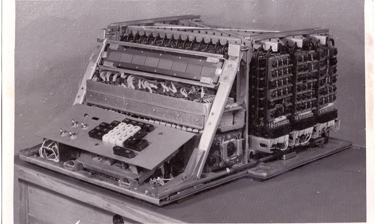 Figure 3 — The Vega prototype opened: racks of ferrite-transistor logic cells behind the keyboard.