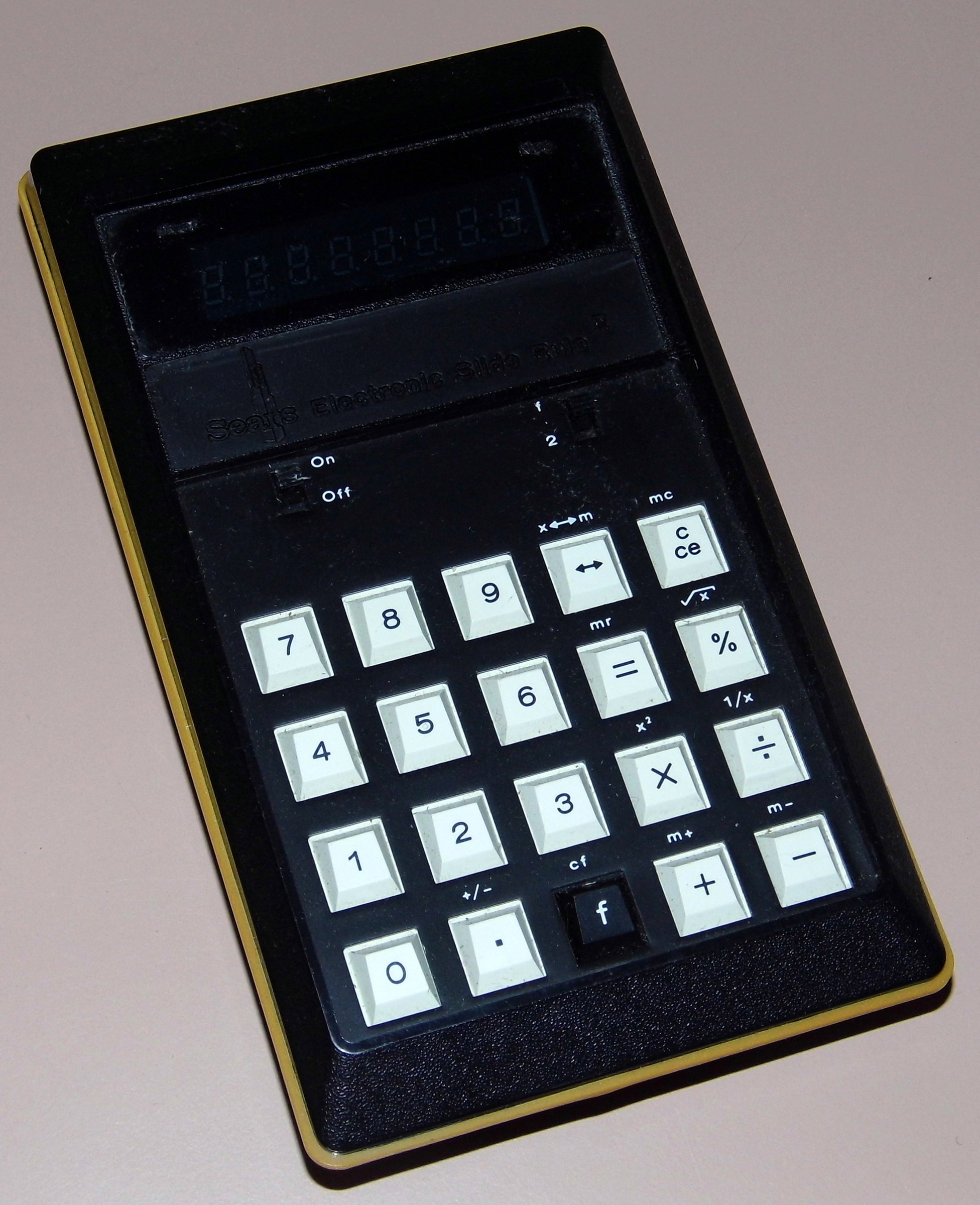 Figure 27 — A Sears Electronic Slide Rule II of about 1974, a scientific pocket machine with a blue fluorescent display, made in Mexico.