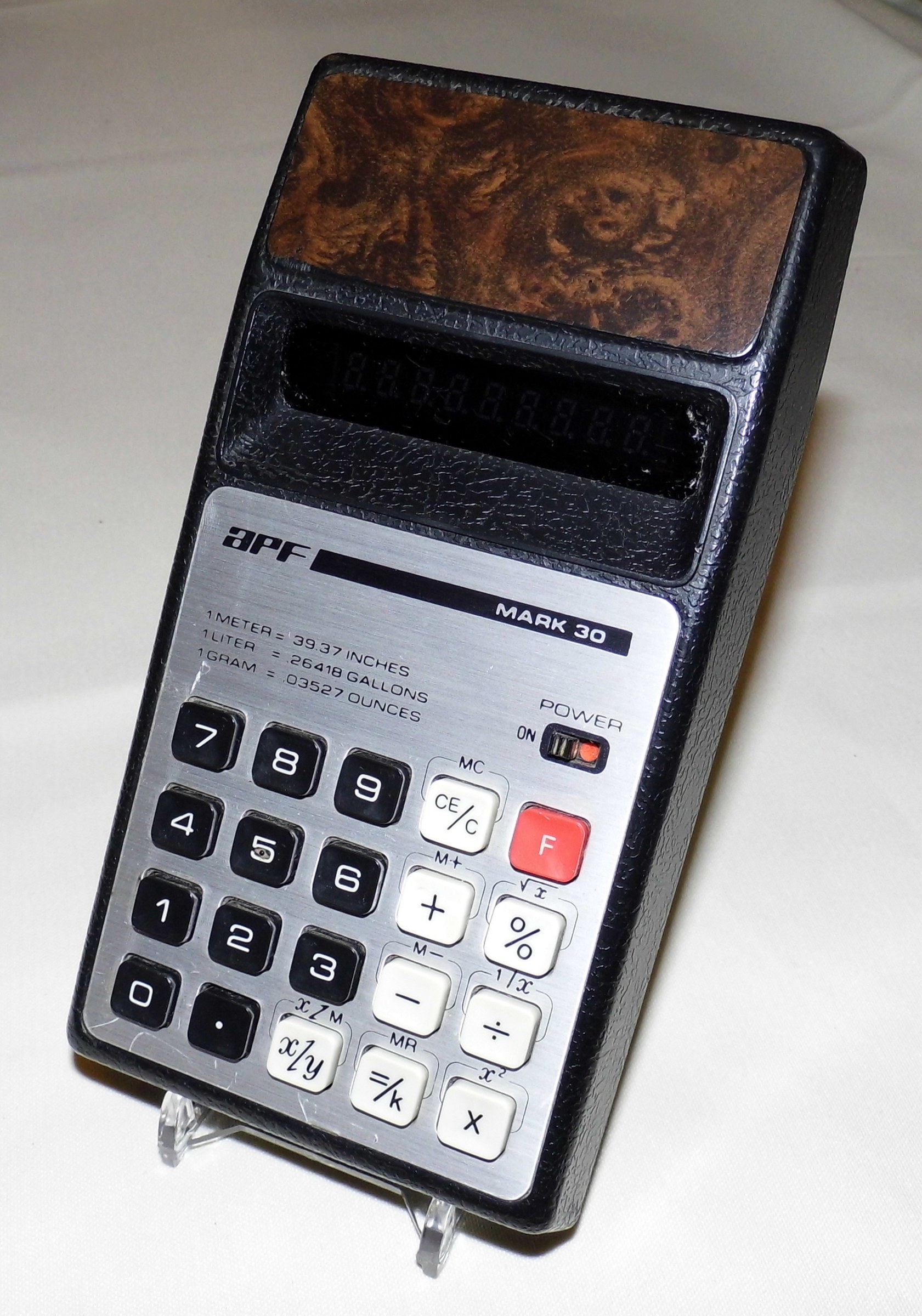Figure 5 — An APF Mark 30, made in Japan in the 1970s, with a woodgrain top and a fluorescent display.